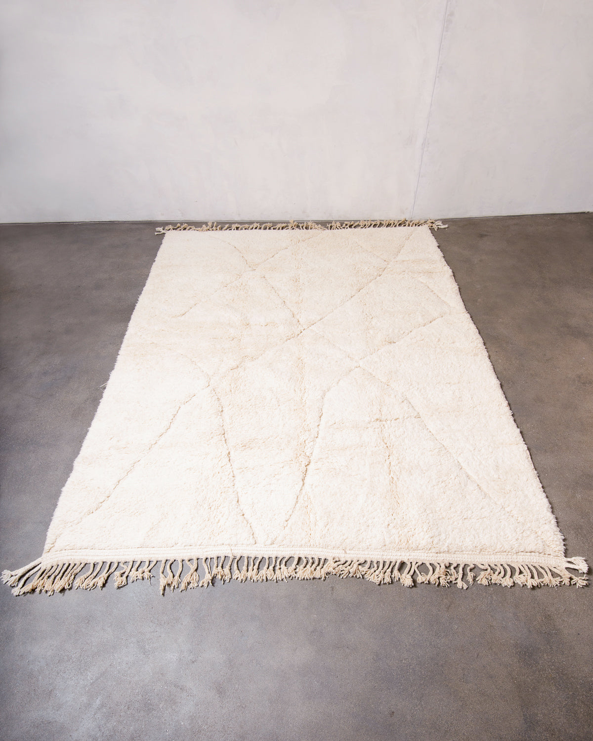 Modern, designer, handcrafted Berber rug from Morocco. Beniourain carpet with minimalist design, natural wool pile and a fluffy texture.